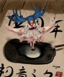  1girl absurdres blue_hair brush calligraphy_brush hatsune_miku highres ink japanese japanese_clothes long_hair oekaki_musume paintbrush solo twintails vocaloid wei_ji wooden_floor 