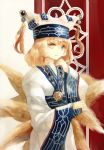  1girl acrylic_paint_(medium) ainu_clothes alternate_costume arm_up blonde_hair fox_tail hat hat_with_ears jewelry keiko_(mitakarawa) long_sleeves looking_to_the_side medallion multiple_tails necklace parted_lips short_hair solo striped striped_background tail tassel touhou traditional_media watercolor_(medium) yakumo_ran yellow_eyes 