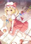  1girl 6u_(eternal_land) apple blonde_hair blush book broken crystal cup flandre_scarlet food frills fruit gloves hat hat_ribbon key looking_at_viewer mob_cap on_bed open_mouth pillow puffy_sleeves red_eyes ribbon sash shirt short_hair short_sleeves side_ponytail sitting skirt skirt_set solo stuffed_animal stuffed_toy teacup teddy_bear text touhou vest white_gloves wings 