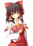 1girl :/ ascot blush bow box_of_chocolates breasts brown_hair collarbone detached_sleeves hair_bow hair_ribbon hair_tubes hakurei_reimu head_tilt highres large_bow looking_at_viewer red_eyes ribbon shy skirt skirt_set solo szk touhou tsurime valentine vest 