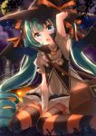  1girl blue_eyes fang green_hair halloween hat hatsune_miku highres jack-o&#039;-lantern jimmy long_hair looking_at_viewer night open_mouth sitting solo striped striped_legwear twintails very_long_hair vocaloid wariza witch_hat 