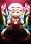  1girl ascot blonde_hair blurry crystal flandre_scarlet glowing gradient gradient_background hat hat_ribbon highres looking_at_viewer mob_cap open_mouth puffy_sleeves red_eyes ribbon shirt short_hair short_sleeves side_ponytail skirt skirt_hold skirt_set smile solo tongue tongue_out touhou ttc vest wings 