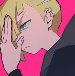 1boy blonde_hair closed_mouth ear_piercing from_side gladion_(pokemon) green_eyes hair_over_one_eye hand_up highres ivib long_sleeves male_focus piercing pink_background pokemon pokemon_sm portrait short_hair simple_background solo 