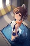  1girl brown_eyes brown_hair i-401_(kantai_collection) kantai_collection kusumoto ponytail pool school_swimsuit solo swimsuit tan towel 