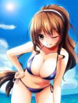  1girl alternate_costume arm_at_side ashigara_(kantai_collection) bikini blue_bikini breasts cleavage collarbone grin hair_between_eyes hairband hand_on_hip highres kantai_collection large_breasts leaning_forward long_hair looking_at_viewer loussier666 midriff navel ocean outdoors parted_lips ponytail side-tie_bikini smile solo swimsuit water wink 