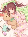  1girl bed blush book brown_eyes brown_hair cellphone commentary_request highres idolmaster idolmaster_cinderella_girls long_hair looking_at_viewer lying notebook ogata_chieri on_side one_eye_closed open_mouth pajamas pen phone pillow ribbon scrunchie solo stuffed_animal stuffed_bunny stuffed_toy twintails yutsumoe 