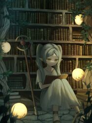  1girl absurdres book bookshelf brown_sandals closed_mouth collarbone dark dress earrings elf frieren full_body green_eyes grey_hair highres holding holding_book indoors jewelry kkamkkam knees_up long_dress long_hair on_floor open_book parted_bangs plant pointy_ears reading sandals short_sleeves sitting solo sousou_no_frieren staff stone_floor teardrop_earrings twintails white_dress 