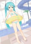  1girl barefoot bikini flat_chest green_eyes green_hair hatsune_miku highres innertube koeda_(koeda1kg) long_hair open_mouth pool side-tie_bikini smile solo striped striped_bikini striped_swimsuit swimsuit twintails vocaloid water water_slide 