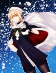  1girl ahoge bag black_legwear blonde_hair bow capelet choker dress dutch_angle fate/grand_order fate_(series) gift_bag gloves hand_on_hip hat highres kamiyan looking_at_viewer over_shoulder pantyhose saber saber_alter santa_hat smile snowing solo yellow_eyes 