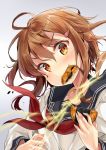  1girl blush brown_eyes brown_hair eating fang folded_ponytail food hair_ornament hairclip ikazuchi_(kantai_collection) kakao_rantan kantai_collection long_hair looking_at_viewer school_uniform senbei serafuku smile solo 