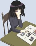  1girl bishoujo_senshi_sailor_moon black_hair black_shirt blue_background chair chin_rest hino_ryutaro light_smile photo_(object) photo_album shirt short_hair solo table tomoe_hotaru violet_eyes 