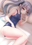  1girl absurdres alternate_costume blue_swimsuit breasts collarbone grey_eyes grey_hair highres kantai_collection kasumi_(kancolle) long_hair lying makura_(user_jpmm5733) on_side one-piece_swimsuit school_swimsuit side_ponytail small_breasts solo swimsuit 