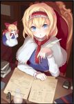  1girl alice_margatroid apron blonde_hair blue_eyes blush book book_stack border capelet doll dress from_above hair_ribbon hairband igakusei long_sleeves looking_at_viewer open_mouth ribbon shanghai_doll short_hair sitting solo table touhou upper_body waist_apron 