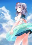  1girl alternate_costume arched_back ass bare_shoulders bikini bikini_top blue_eyes blue_skirt blue_sky breasts clouds cloudy_sky flower hair_between_eyes hair_flower hair_ornament highres innertube kantai_collection kashima_(kantai_collection) large_breasts long_hair looking_to_the_side outdoors silver_hair skirt sky smile swimsuit tsurime twintails wavy_hair zhaitengjingcang 