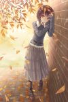  1girl against_wall autumn autumn_leaves belt brown_eyes brown_hair falling_leaves frilled_skirt frills highres leaf long_skirt looking_at_viewer photo_reference skirt sleeves_past_wrists solo standing tokumaru 