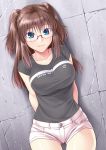  1girl against_wall arms_behind_back blue_eyes breasts brown_hair clothes_writing collarbone cowboy_shot glasses heart imada_kozue large_breasts long_hair looking_at_viewer original rimless_glasses shirt short_shorts shorts solo t-shirt thigh_gap two_side_up 