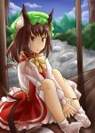 1girl animal_ears bow chen dress eyebrows fingernails full_body hat highres jewelry kon_hazuki long_sleeves looking_at_viewer mob_cap mountain multiple_tails red_dress ribbon short_hair smile socks tail touhou 
