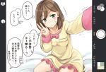  1girl bed_sheet bow brown_hair cellphone cellphone_camera cellphone_display commentary_request green_eyes mikkii original pajamas partially_translated phone phone_screen self_shot sitting solo sweatdrop translation_request w 