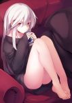  1girl bags_under_eyes bangs barefoot can collarbone couch expressionless eyebrows feet haegiwa hair_between_eyes highres indoors legs long_hair looking_at_viewer naked_sweater original pillow red_eyes sidelocks sitting sleeves_past_wrists solo sweater white_hair 