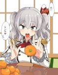  1girl :d double-breasted double_bun epaulettes food fruit grey_eyes highres kantai_collection kashima_(kantai_collection) kotatsu kozou_(rifa) looking_at_viewer mandarin_orange no_hat open_mouth silver_hair smile solo table teeth translated twintails 