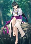  1girl :o ayasato_mayoi bangs bare_legs black_hair blue_eyes blunt_bangs blush collarbone eyebrows eyebrows_visible_through_hair forest gyakuten_saiban hair_bobbles hair_bun hair_ornament head_tilt highres japanese_clothes jewelry kimono knee_up long_hair looking_at_viewer low-tied_long_hair low_ponytail magatama mahito nature necklace no_socks open_mouth outdoors pendant plant rock sandals sash sidelocks sitting solo toenail_polish toes tree very_long_hair 