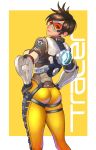  1girl absurdres ass back bangs black_hair bodysuit brown_hair character_name closed_mouth clothes_writing cross-laced_clothes earrings from_below gloves glowing goggles hands_on_hips highres jacket jewelry looking_at_viewer looking_back overwatch shigatsugata short_hair skin_tight smile solo swept_bangs thigh_strap tracer_(overwatch) white_border yellow_background 
