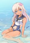  1girl blonde_hair blue_eyes flower hair_flower hair_ornament highres kantai_collection long_hair open_mouth partially_submerged ro-500_(kantai_collection) swimsuit tan tanline tiphereth 