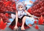  1girl animal_ears autumn_leaves bare_shoulders barefoot highres inubashiri_momiji leaf looking_at_viewer pom_pom_(clothes) red_eyes short_hair shou_(ahiru_shinobu) silver_hair solo sword tail touhou weapon weapon_bag wolf_ears wolf_tail 