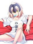  1girl armor blonde_hair breasts clothes_writing fate/grand_order fate_(series) headpiece highres jeanne_alter looking_at_viewer mouth_hold pillow popsicle ruler_(fate/apocrypha) ruler_(fate/grand_order) short_hair sitting skylader solo yellow_eyes 