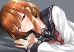  1girl absurdres anchor_symbol bed_sheet blush brown_eyes brown_hair collarbone eyebrows eyebrows_visible_through_hair eyes_visible_through_hair fang_out go-1 hair_between_eyes hair_ornament hairclip highres ikazuchi_(kantai_collection) kantai_collection light_smile looking_at_viewer lying on_side school_uniform upper_body 