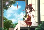  1girl architecture ascot bow brown_hair clouds collar commentary_request detached_sleeves east_asian_architecture frilled_collar frilled_skirt frills hair_bow hair_tubes hakurei_reimu highres kotori_(kotorikotori0206) looking_at_viewer plant porch red_bow red_skirt sidelocks sitting skirt skirt_set solo sunlight sweat touhou wide_sleeves wind_chime yellow_eyes 