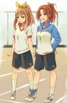  2girls :o blonde_hair brown_hair clenched_hands dot_nose full_body green_eyes gym_shorts gym_uniform hibike!_euphonium highres jacket monsieur multiple_girls nakagawa_natsuki open_mouth ponytail shorts three-legged_race track track_jacket violet_eyes yoshikawa_yuuko 