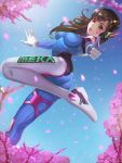  1girl absurdres ass bangs baobingyazi bodysuit breasts brown_eyes brown_hair cherry_blossoms clothes_writing d.va_(overwatch) facial_mark finger_gun gloves headphones high_collar highres large_breasts long_hair looking_at_viewer one_leg_raised outstretched_arms overwatch petals pink_lips pointing pointing_at_viewer skin_tight solo whisker_markings white_gloves 