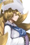  1girl blonde_hair blurry breast_hold breasts commentary_request depth_of_field dress fox_tail hachachi hands_in_sleeves hat highres kyuubi large_breasts long_sleeves looking_at_viewer mob_cap multiple_tails pillow_hat profile short_hair solo tabard tail tassel touhou upper_body white_dress wide_sleeves yakumo_ran yellow_eyes 