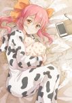  1girl animal_hood blush bow cellphone closed_mouth cow_hood cow_print earphones earphones from_side hair_bow hood koroneko_p0w0q long_hair looking_at_viewer lying on_side orange_bow orange_eyes original pajamas phone pillow pink_hair polka_dot_pillow print_pajamas smartphone smartphone_case smile solo twintails 
