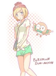  1girl anchan blonde_hair blue_eyes female_protagonist_(pokemon_sm) highres pokemon pokemon_(creature) rowlet shirt short_hair shorts tied_shirt 