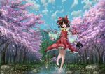  1girl absurdres ascot barefoot black_hair blue_sky cherry_blossoms clouds detached_sleeves full_body hair_ribbon hair_tubes hakurei_reimu highres japanese_clothes lake landscape long_sleeves looking_at_viewer midriff miko nature open_mouth petals ribbon ribbon-trimmed_sleeves ribbon_trim scenery shirt short_hair skirt skirt_set sky smile solo torii touhou tree ultra-taf water wide_sleeves 
