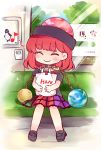  1girl black_shirt couch earth_(ornament) full_body ground_vehicle haneo_(hao) hecatia_lapislazuli holding_bag moon_(ornament) multicolored_skirt musical_note off_shoulder plaid plaid_skirt polos_crown redhead shirt sitting skirt smile touhou train train_interior 