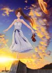  1girl bare_shoulders barefoot brown_hair collarbone dress hat high_heels highres holding holding_shoes light long_hair original ponytail red_eyes sandals sandals_removed shigatsu_itsuka shoes shoes_removed solo straw_hat sunset twilight 