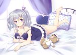  1girl barefoot blush breasts cleavage closed_mouth curtains frilled_pillow frills full_body grey_hair hat heart heart_pillow kantai_collection kashima_(kantai_collection) lying nightgown on_bed on_stomach peaked_cap pillow polka_dot_pillow smile solo strap_slip stuffed_animal stuffed_toy teddy_bear twintails uniform violet_eyes window yoshikita_popuri 