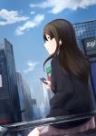  1girl black_hair earphones earrings from_behind green_eyes grey_skirt hair_between_eyes hand_in_pocket highres holding idolmaster idolmaster_cinderella_girls jewelry long_hair outdoors pleated_skirt profile shibuya_rin sitting skirt solo yashigaras 