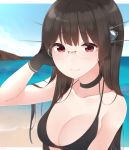  1girl arm_up bare_shoulders beach bikini black_bikini black_gloves black_hair breasts choker choukai_(kantai_collection) cleavage closed_mouth commentary_request gloves hand_in_hair headgear highres kantai_collection large_breasts light_smile long_hair looking_at_viewer outdoors red_eyes sky solo swimsuit upper_body water yukichi_(sukiyaki39) 