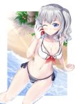  1girl ;) adapted_costume alternate_costume arm_support ayakase_hotaru beach bikini blue_eyes bottle bottle_to_cheek breasts cleavage coconut_tree front-tie_top highres kantai_collection kashima_(kantai_collection) navel one_eye_closed palm_tree partially_submerged sailor_bikini sailor_collar sand silver_hair sitting smile soda_bottle solo swimsuit tree twintails water wavy_hair 