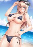  1girl adjusting_clothes adjusting_hat beach bikini bismarck_(kantai_collection) blonde_hair blue_eyes breasts buchan hand_on_hip hat kantai_collection large_breasts long_hair peaked_cap solo standing swimsuit under_boob 