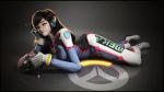  1girl 3d bangs black_border bodysuit border breasts brown_eyes brown_hair charm_(object) clothes_writing d.va_(overwatch) emblem facepaint facial_mark finger_on_trigger full_body gloves glowing glowing_weapon graxious_art grey_background gun handgun head_rest headphones highres light_smile logo long_hair looking_at_viewer lying medium_breasts on_stomach overwatch pilot_suit pistol reflective_floor solo swept_bangs v wallpaper weapon whisker_markings white_gloves 