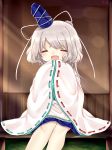  1girl blue_skirt blush cheunes closed_eyes hands_together happy hat highres japanese_clothes kariginu legs_together mononobe_no_futo open_mouth ponytail ribbon_trim silver_hair sitting skirt smile tate_eboshi touhou wide_sleeves 