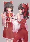  2girls ascot black_hair bloomers blush bow brown_eyes detached_sleeves frilled_shirt_collar frills from_side gohei grey_background hair_bow hair_tubes hakurei_reimu highres holding holding_stick long_hair multiple_girls petticoat profile red_bow red_eyes red_shirt red_skirt ribbon-trimmed_sleeves ribbon_trim shirt skirt skirt_set smile stick taguno touhou underwear wide_sleeves 