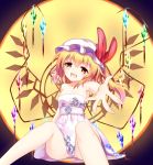  1girl bare_arms black_background blonde_hair bow collarbone crystal dress fang flandre_scarlet full_moon hair_between_eyes hat hat_bow head_tilt highres leisikukki looking_at_viewer mob_cap moon no_panties open_mouth orange_eyes outstretched_arm red_bow sash side_ponytail sitting smile solo strapless strapless_dress tareme touhou white_dress white_hat wings 