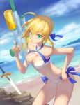 1girl absurdres ahoge bangs bare_shoulders beach bikini blonde_hair blue_bow bow breasts cleavage clouds collarbone dutch_angle excalibur fate/stay_night fate_(series) finger_on_trigger green_eyes gun hair_between_eyes hair_bow hair_ribbon halterneck hand_on_hip highres holding holding_gun holding_weapon index_finger_raised leaning_forward medium_breasts multicolored_bikini navel ocean outdoors planted_sword planted_weapon ribbon rock saber short_hair sky smile solo strapless strapless_bikini sunlight super_soaker swimsuit sword water_gun weapon white_bikini 
