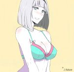  1girl anna_nishikinomiya artist_name bare_shoulders blue_eyes blush bra breasts cleavage drooling highres j_adsen large_breasts shimoneta_to_iu_gainen_ga_sonzai_shinai_taikutsu_na_sekai simple_background solo underwear yellow_background 